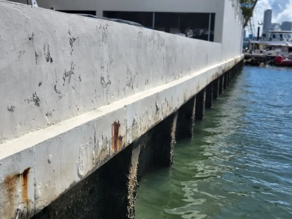 An image showing hole formed behind a seawall