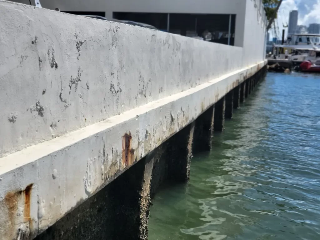 An image showing hole formed behind a seawall